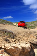 The car on a dirt road on a mountain slope. Greece. Rhodes..