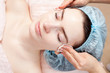 Beautiful woman with clear skin getting beauty treatment of her