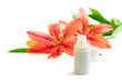 Bottle of cream/lotion with lily flowers, closeup shot, on white Bottle of cream/lotion with lily flowers, closeup shot, on white