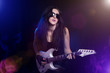 fashion girl with guitar playing hard rock