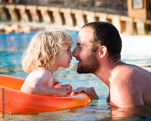 Photo: Happy child playing with father Happy child playing with father