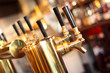 Row of beer taps in a tavern.