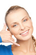 woman making a call me gesture