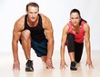Athletic man and woman doing fitness exercise