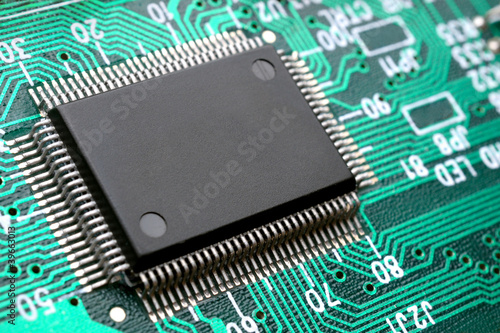 Photo: Chip on circuit board closeup Chip on circuit board closeup