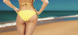 female backside in a yellow swimsuit, 60s style female backside in a yellow swimsuit, 60s style
