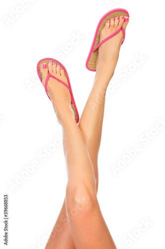 Photo: Female legs with flip-flops Female legs with flip-flops