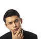 Photo: Young Asian Corporate Man Pondering Over White Background Young Asian Corporate Man Pondering Over White Background