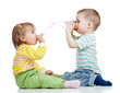 boy and girl drinking juice from glass