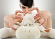 woman killing her teddy bear