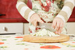 Female hands slicing cabbage