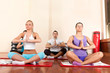 Young people practice yoga