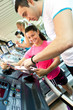 young man with instruction on a treadmill