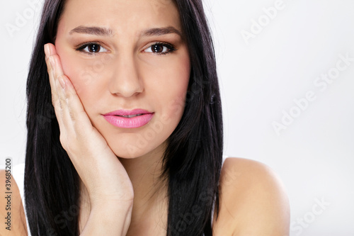 Photo: young woman with toothache young woman with toothache