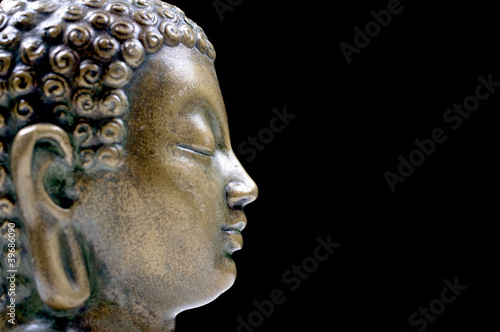 Photo: Bronze Buddha isolated profile Bronze Buddha isolated profile