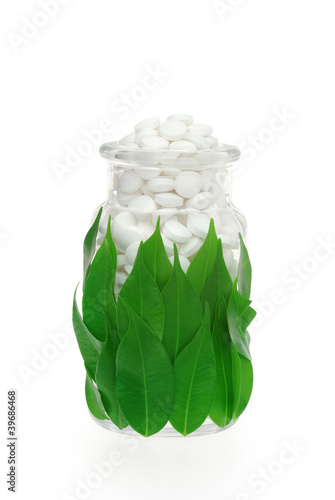 Photo: Herbal supplement pills in pill bottle – alternative medicine Herbal supplement pills in pill bottle – alternative medicine