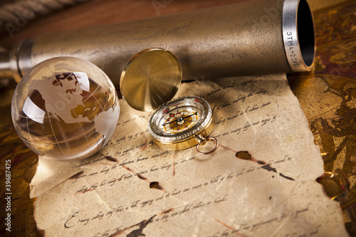 Photo: Vintage letter, compass and navigation equipment on map Vintage letter, compass and navigation equipment on map
