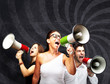 Photo: people shouting with megaphone against a grunge wall people shouting with megaphone against a grunge wall