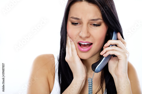 Photo: woman having terrible toothache woman having terrible toothache
