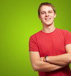 portrait of young man smiling over green background portrait of young man smiling over green background