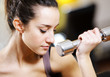 portrait of  young woman lifting free weights