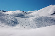 alpine skiers on long slopes in French Alps alpine skiers on long slopes in French Alps