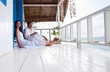 Romantic young couple in tropical beach house