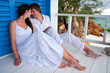 Romantic young couple in tropical beach house