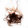 young woman lying in bed