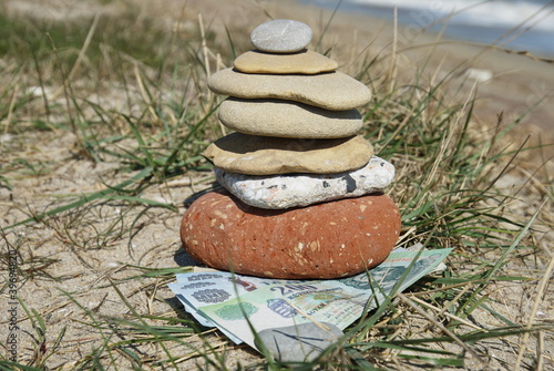 Photo: hungarian forints under some pebbles hungarian forints under some pebbles