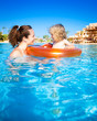 Child with mother in swimming pool Child with mother in swimming pool