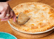 Home made apple pie on wooden table