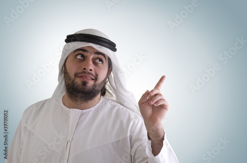 Photo: arabian man in business presentation - clipping path included arabian man in business presentation - clipping path included