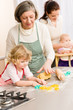 Little girl cutting dough for cookies