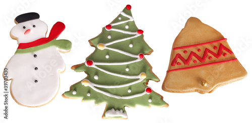 Photo: close up shot of Christmas cookies isolated over white close up shot of Christmas cookies isolated over white