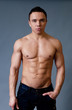 Sexy naked torso fit and neat young man studio portrait