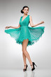 brunette in teal dress brunette in teal dress