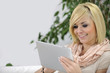 woman reading an ebook on her digital tablet