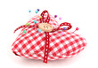 Colored pinheads in pin-cushion isolated on white