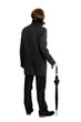 elegant man in a raincoat standing back