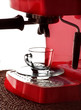a glass cup and espresso machine