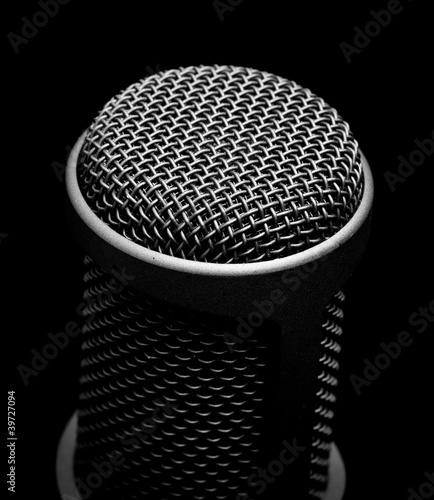 Photo: professional microphone on black background professional microphone on black background