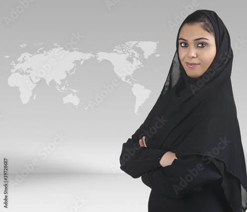 Photo: professional islamic girl with hijab against business background professional islamic girl with hijab against business background