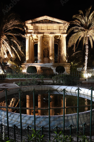 Valletta: night view of greek temple dedicated to sir Alexander Ball in Lower Barracca Gardens - Malta