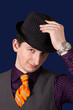 Young man with hat and orange necktie