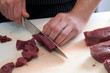 Photo: Der Koch bei der Arbeit - Wild, Fleisch schneiden, Portionieren Der Koch bei der Arbeit - Wild, Fleisch schneiden, Portionieren
