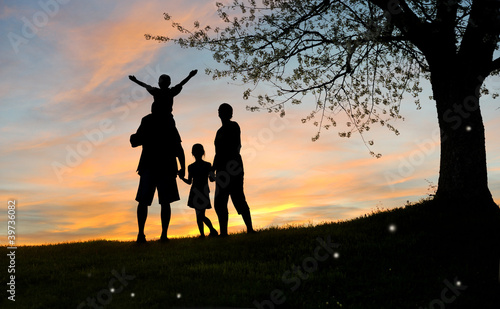 Photo: Happy family, father, mother, son and daughter Happy family, father, mother, son and daughter