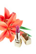 New lipstick and lily flowers, isolated on white background New lipstick and lily flowers, isolated on white background
