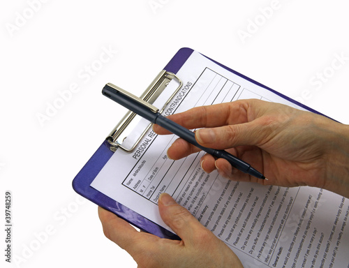 Photo: Offering pen and form to patient Offering pen and form to patient