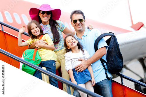 Photo: Family traveling by airplane Family traveling by airplane